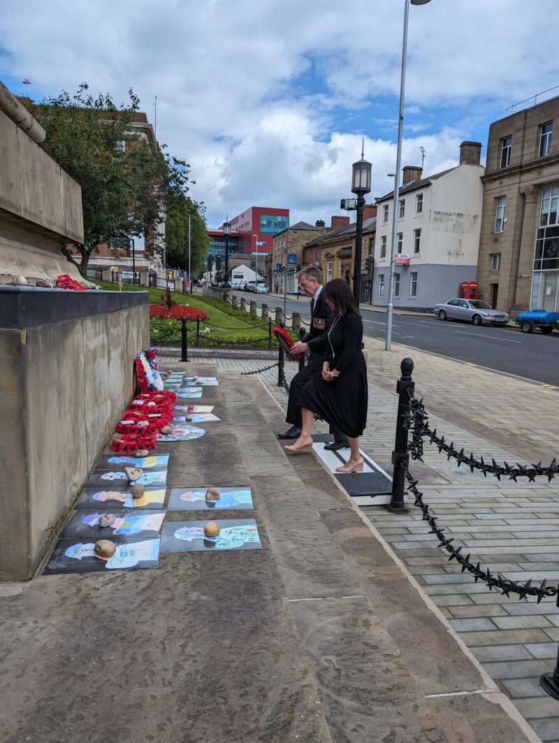Stephanie Peacock and Dan Jarvis laying a wreath at the D Day memorial in Barnsley 