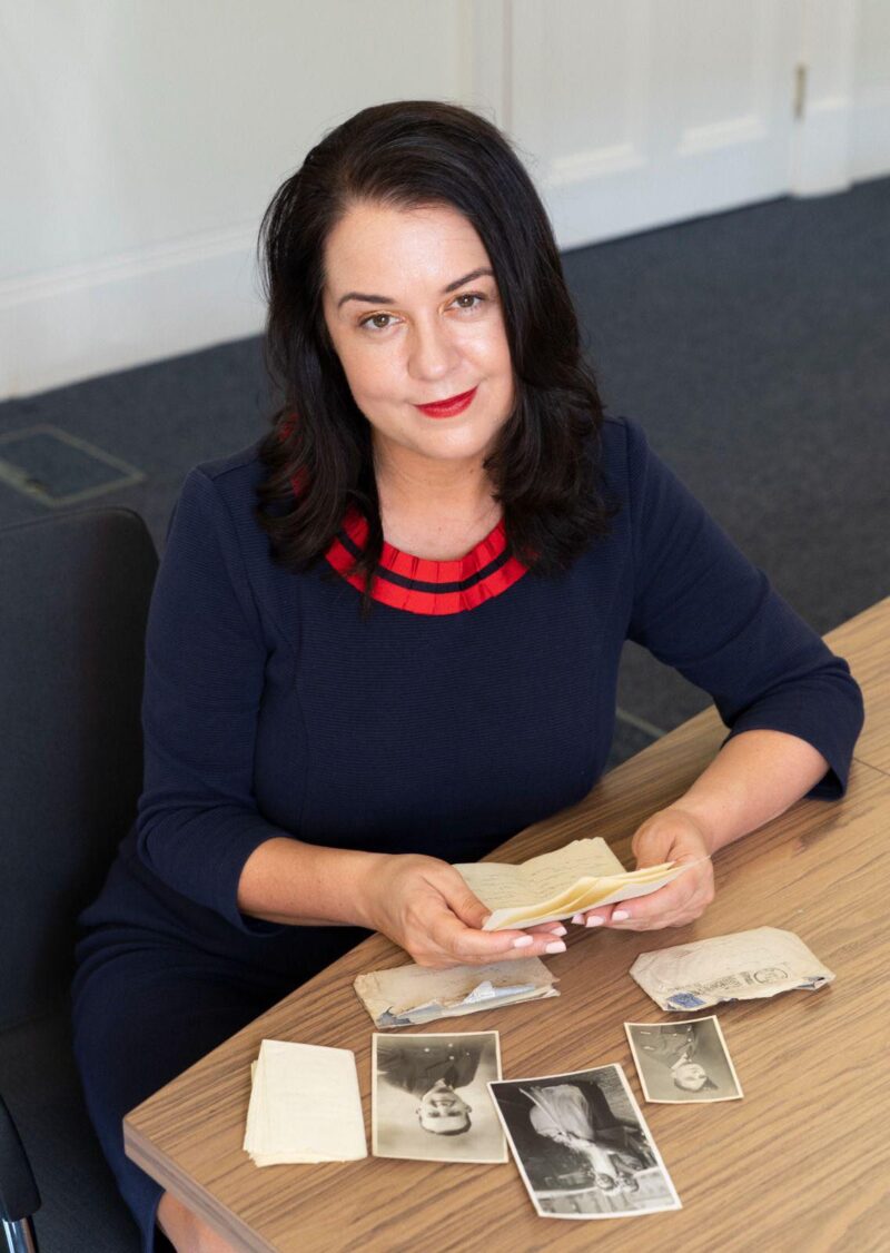 Stephanie Peacock MP looking through photos of her Grandad who served in WWII, Photo Credit: Louis Wood/ The Sun
